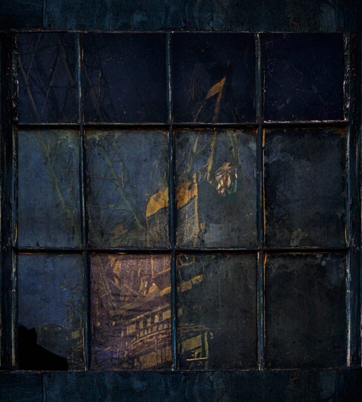 Reflection of a crane in an old window at Mare Island Shipyard